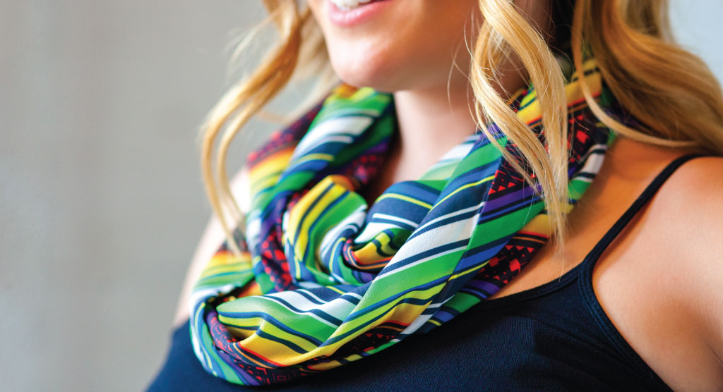 woman wearing brightly colored striped infinity scarf and black tank top